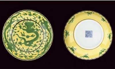 A pair of green and yellow glazed saucer dishes